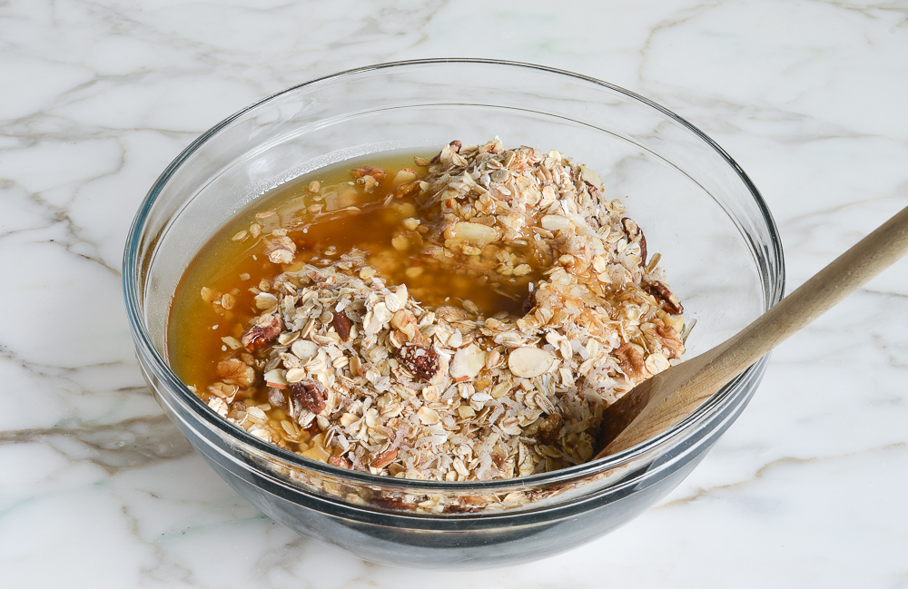 adding liquid ingredients to dry ingredients in large bowl