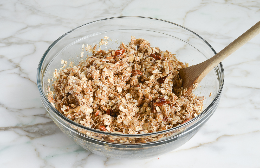 liquid and dry ingredients mixed together in large glass bowl