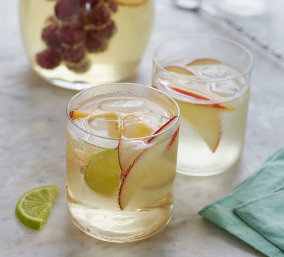 Two glasses of sparkling white sangria.