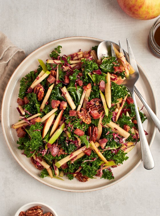 kale, apple, and pancetta salad on plate