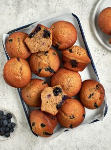 blueberry maple bran muffins on baking tray