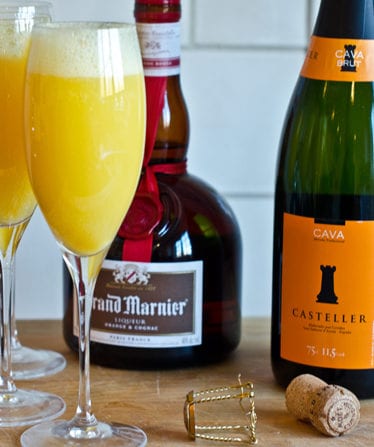 Grand mimosas in champagne glasses.