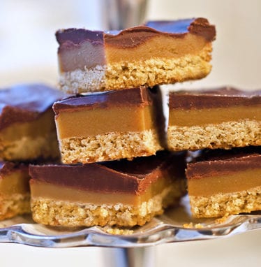 Stack of chocolate caramel shortbread squares (Millionaire's shortbread).