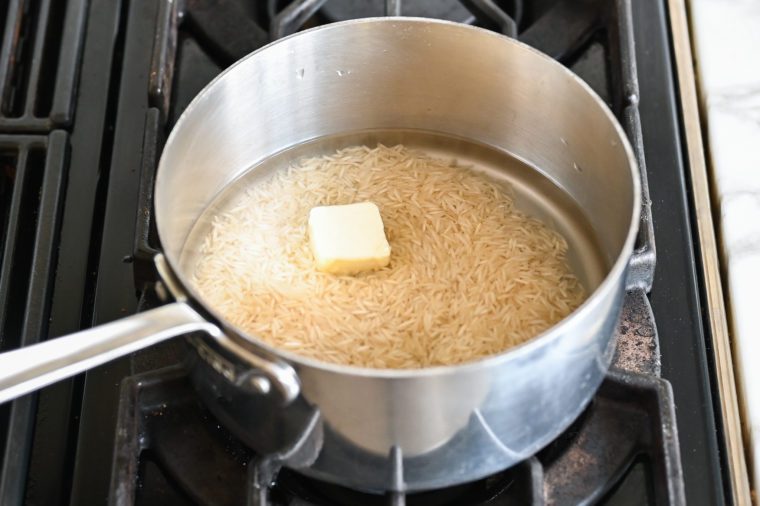 rice, water, salt, and butter in bowl