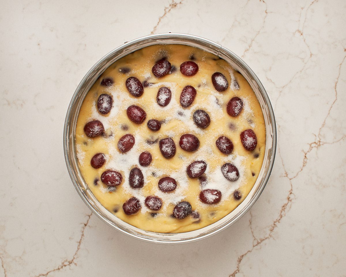 batter and grapes in prepared pan