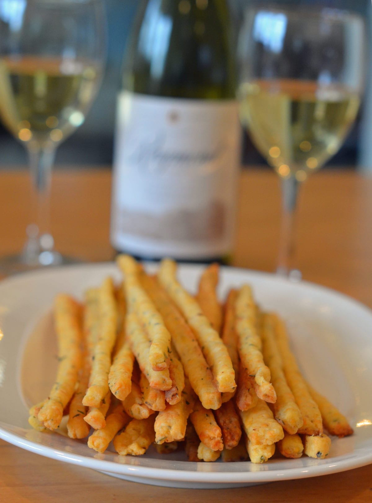 https://www.onceuponachef.com/images/2014/11/Cheddar-and-Herb-Cheese-Straws-with-Wine-1200x1624.jpg