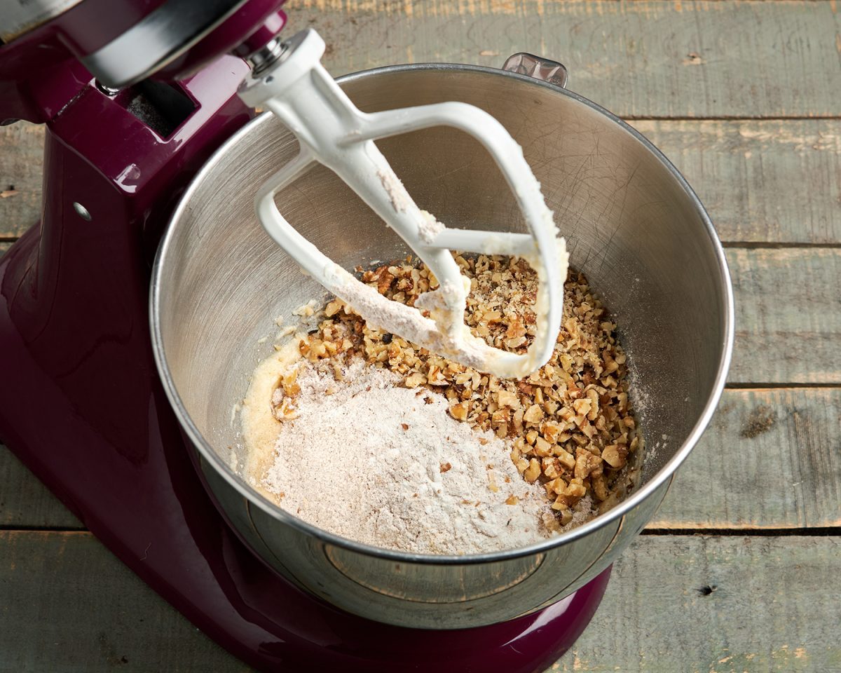 adding drying ingredients and nuts to batter