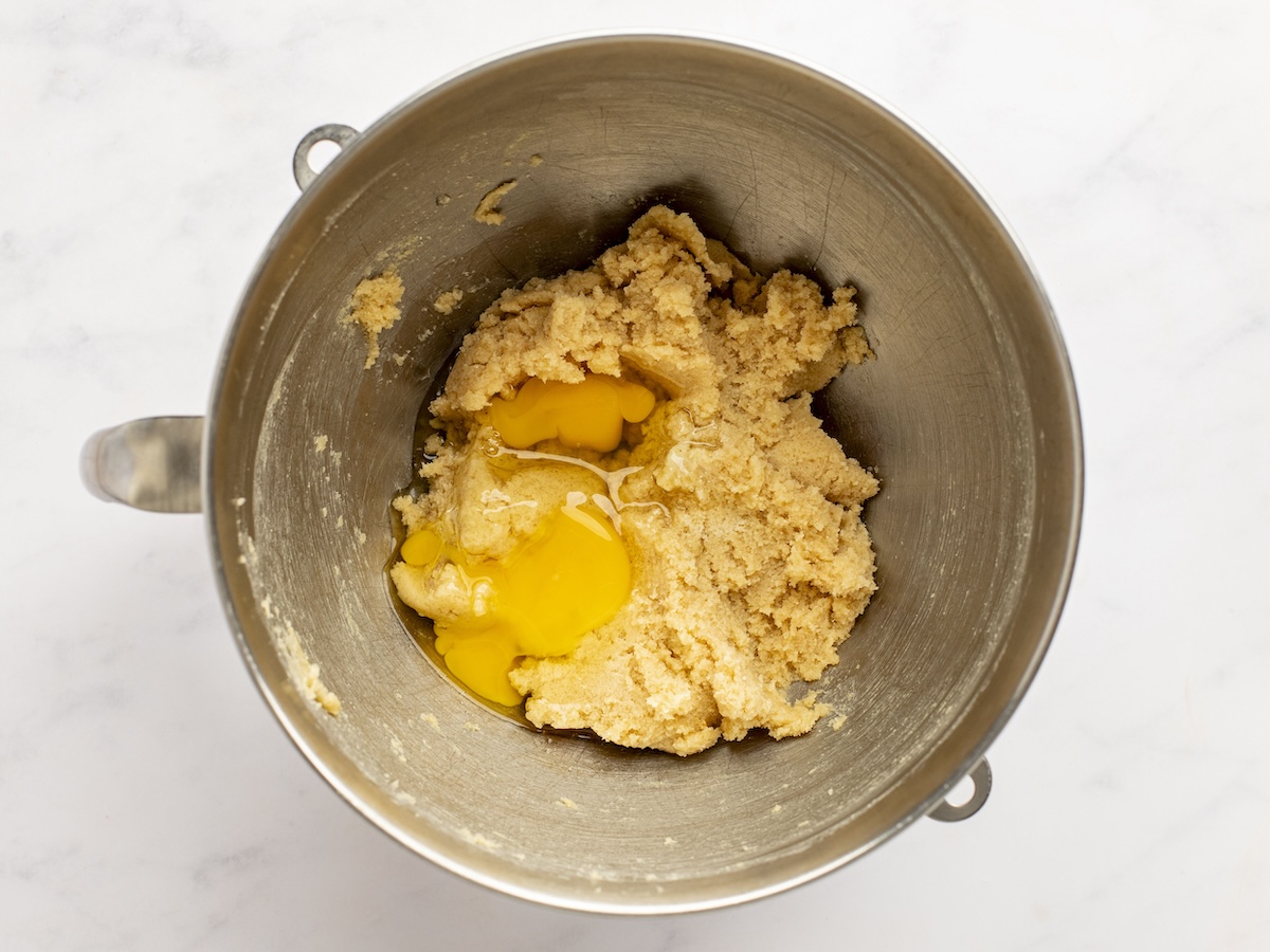 adding eggs to creamed butter and sugar