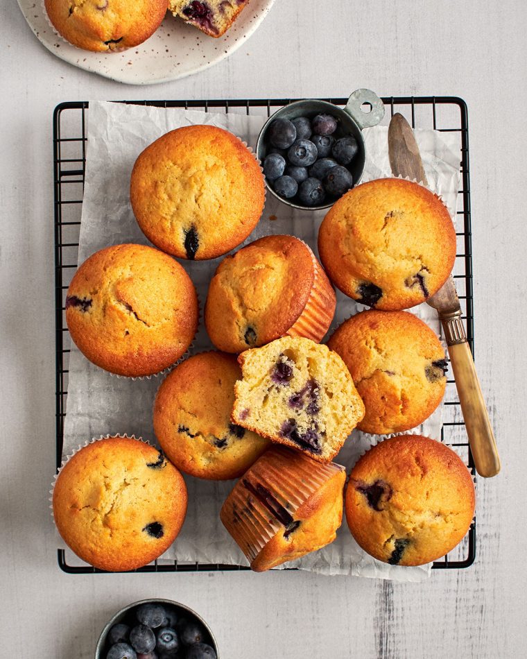 blueberry cornbread muffins cooling on rack