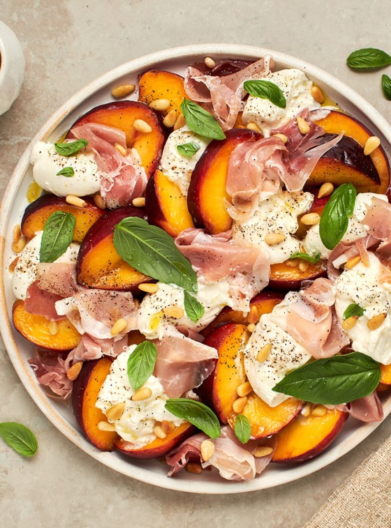 Summer Peach & Burrata Salad with Prosciutto on platter