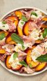 Summer Peach & Burrata Salad with Prosciutto on platter