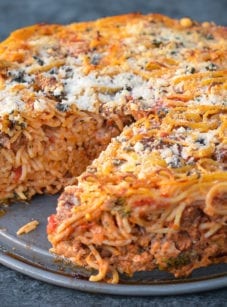 Spaghetti pie missing a slice.