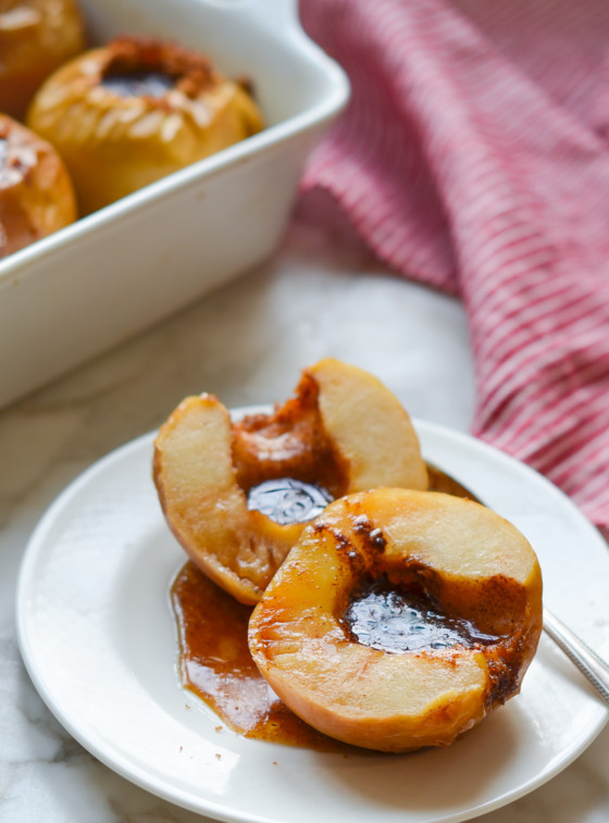 Baked apples on a small plate.