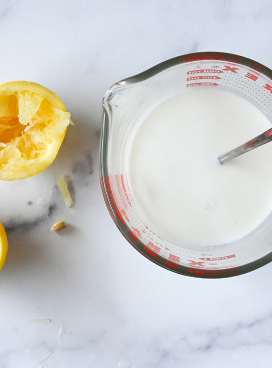 milk and lemon juice in measuring cup