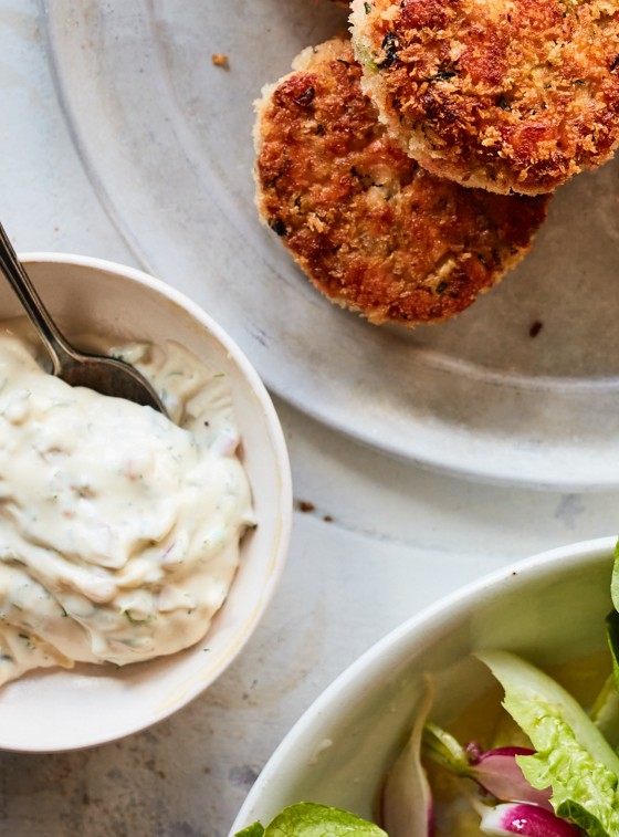 Spoon in a bowl of tartar sauce.