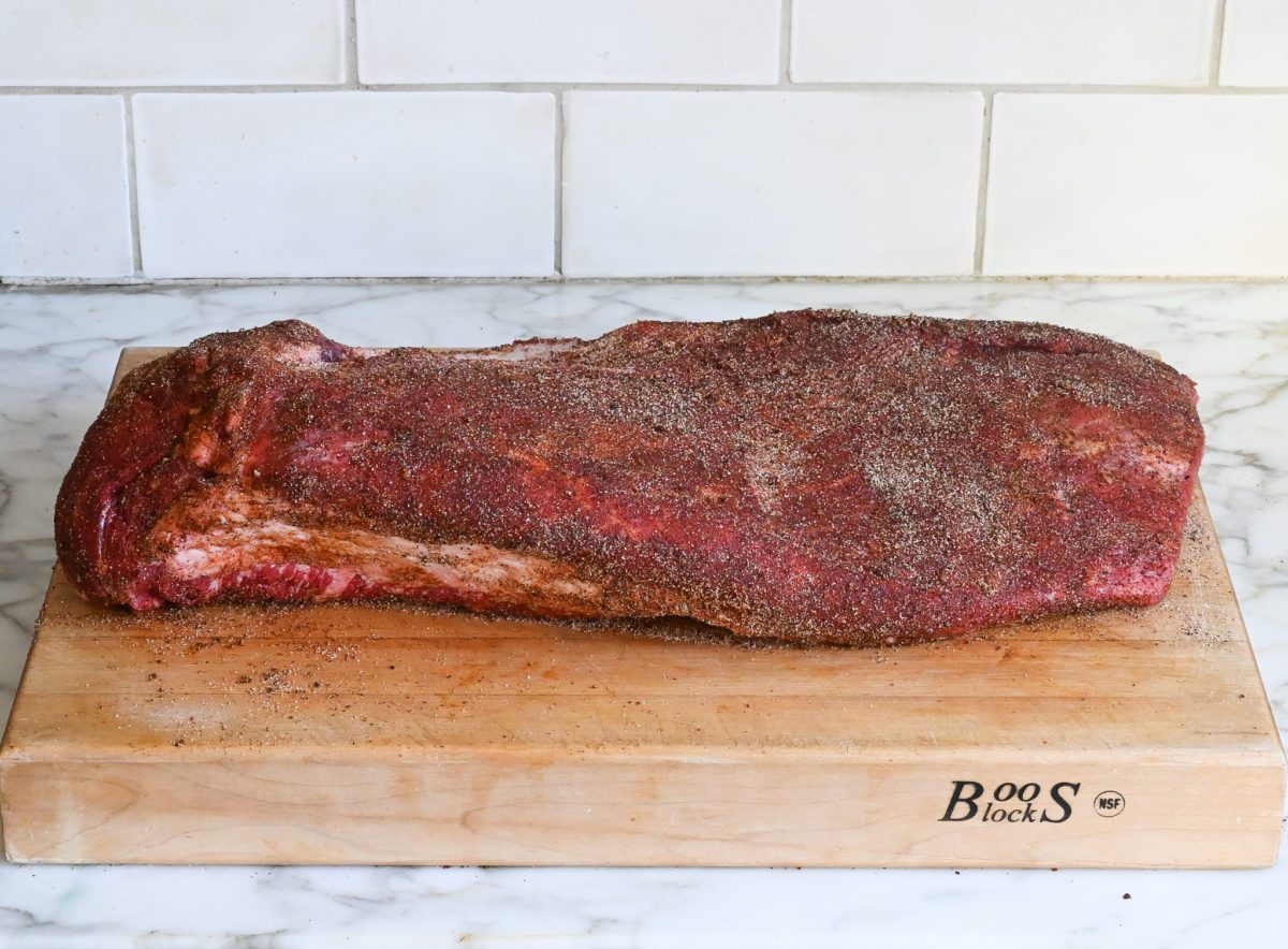 seasoned brisket on cutting board