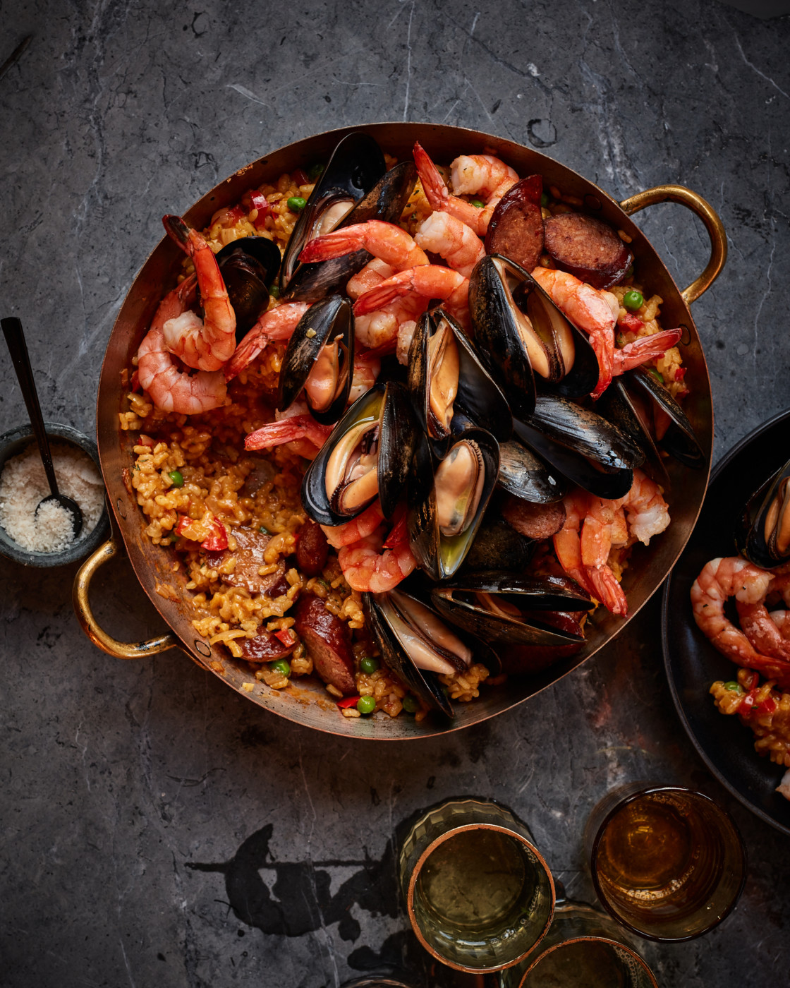 Paella in beautiful copper paella pan.