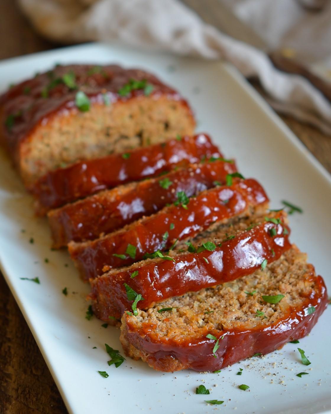 Platter of sliced turkey meatloaf.