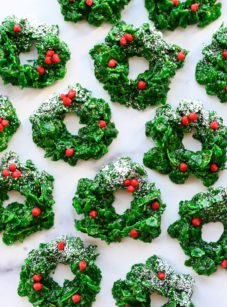 Christmas wreath cookies on marble board.