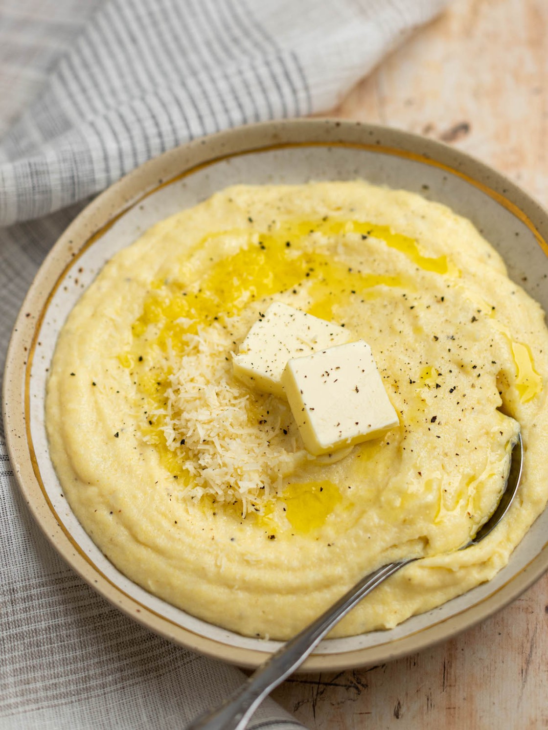 creamy polenta with butter in bowl.