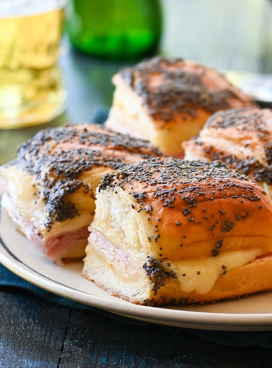 Ham and cheese sliders on a plate.