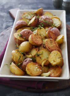 Roasted potatoes on a serving platter.