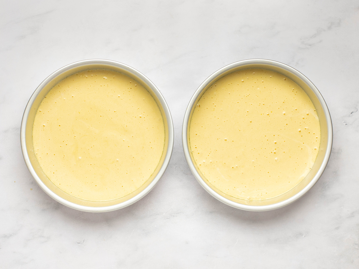 batter poured into two 9-inch round pans