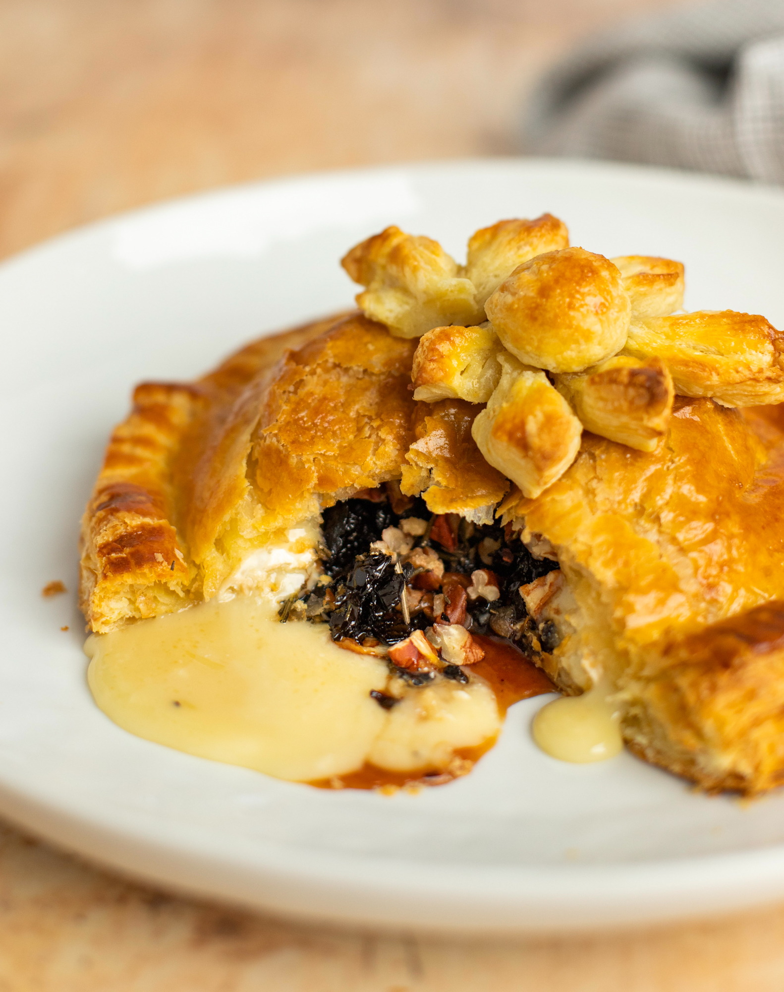 Baked Brie En Croûte With Honey Dried Cherries Rosemary And Pecans Once Upon A Chef 