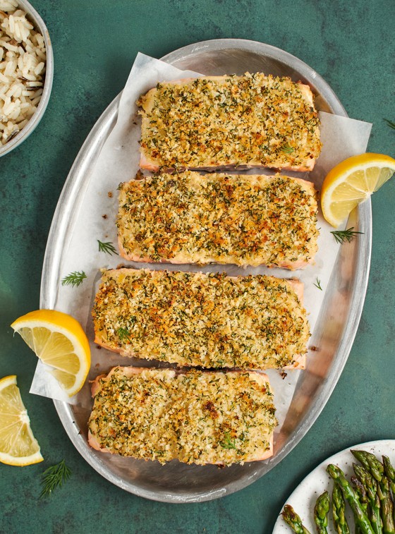 baked salmon on platter served with asparagus and rice