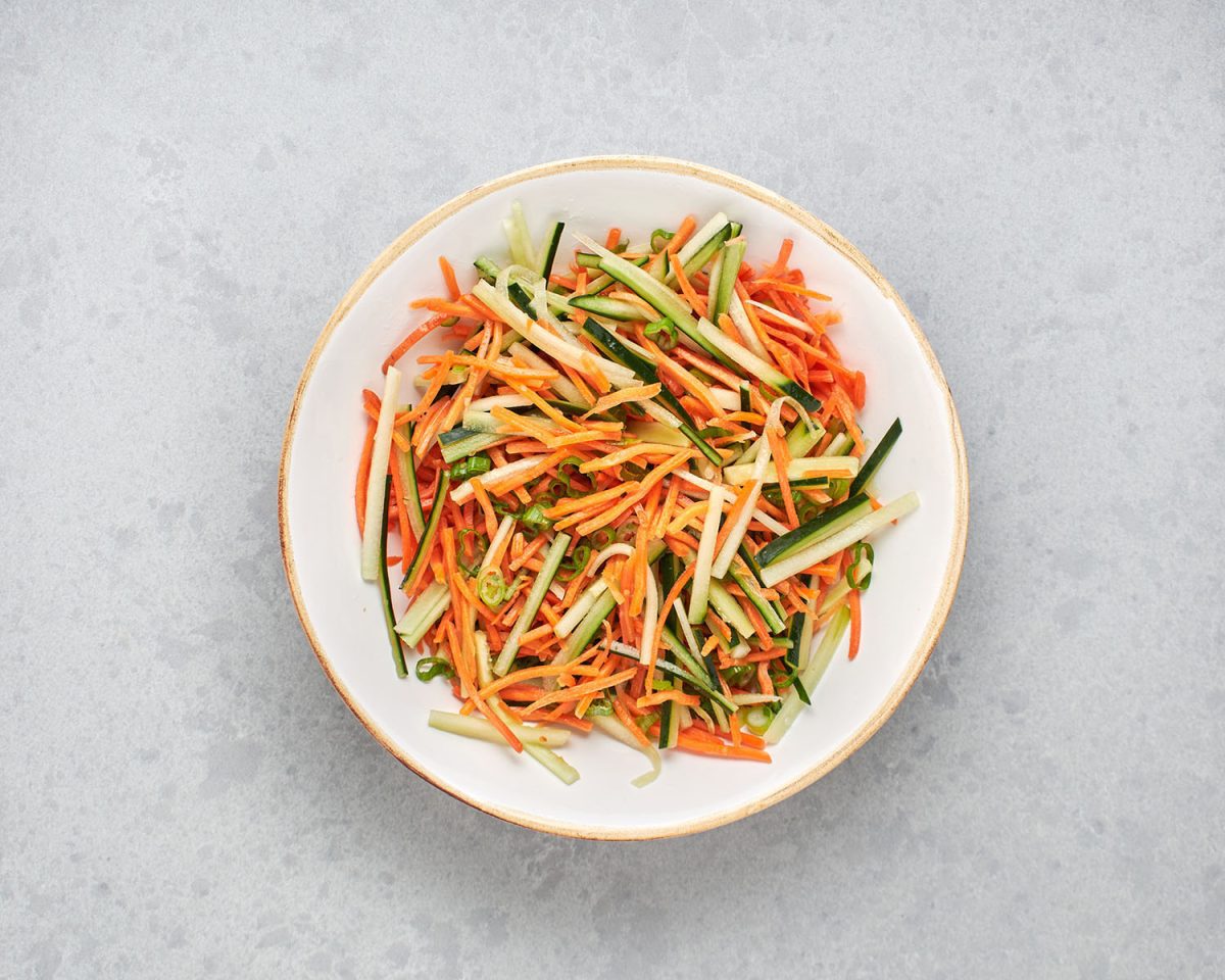 combined veggie ingredients for summer rolls in mixing bowl.