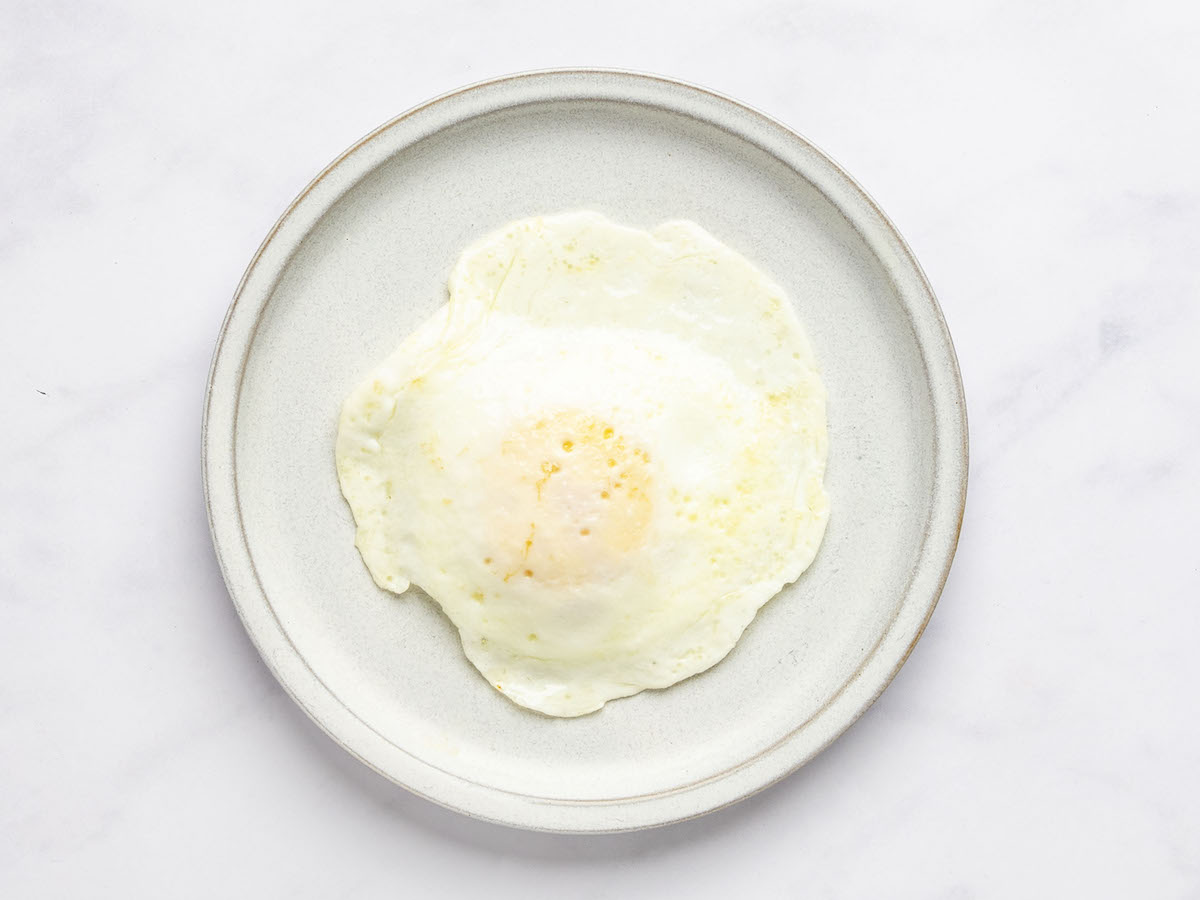 over easy egg on white plate