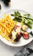 bearnaise sauce on steak and asparagus