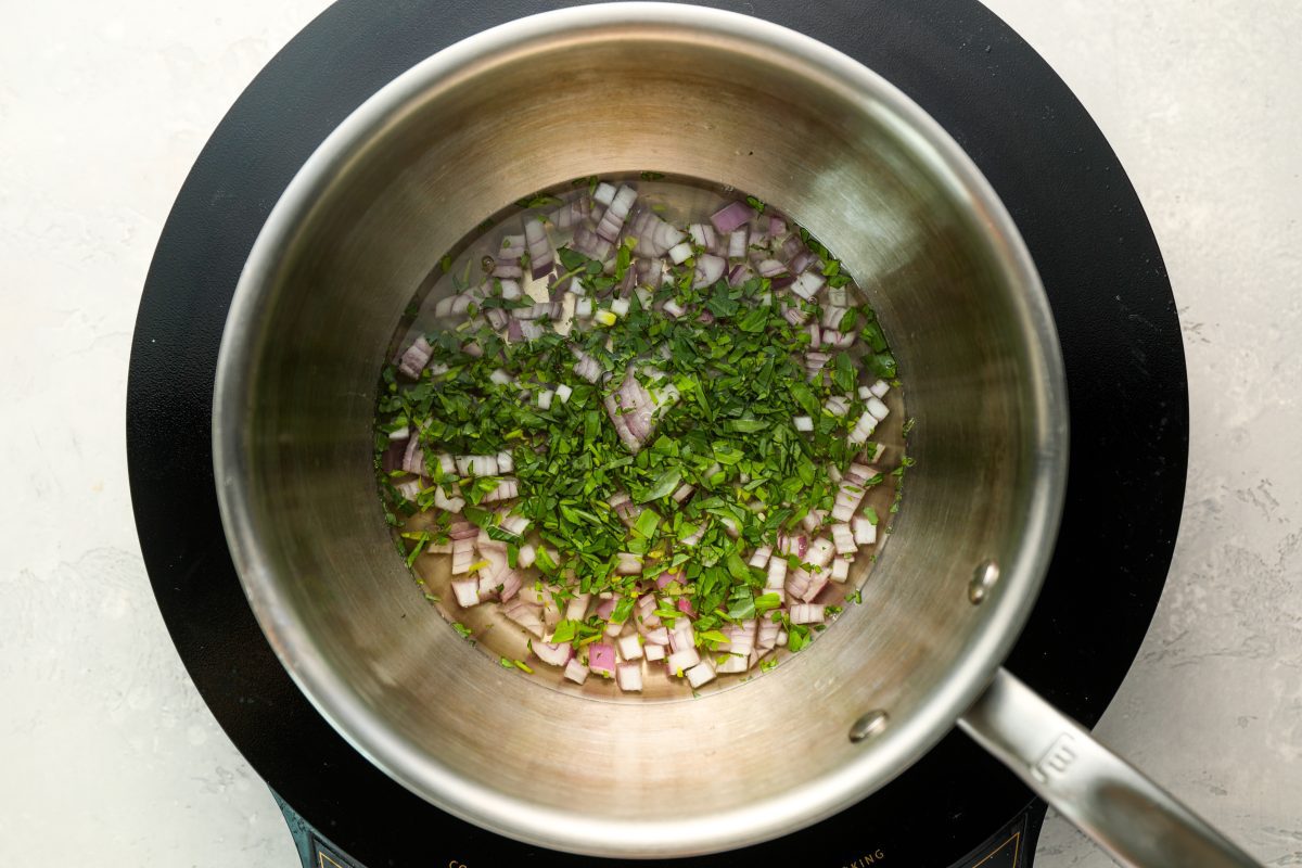 shallots, 1 tablespoon of chopped tarragon, white wine vinegar, and winein small saucepan