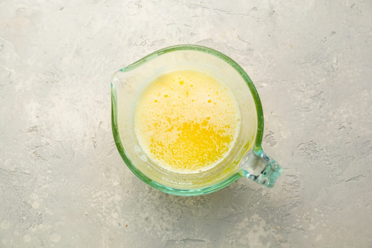 melted butter in glass measuring cup