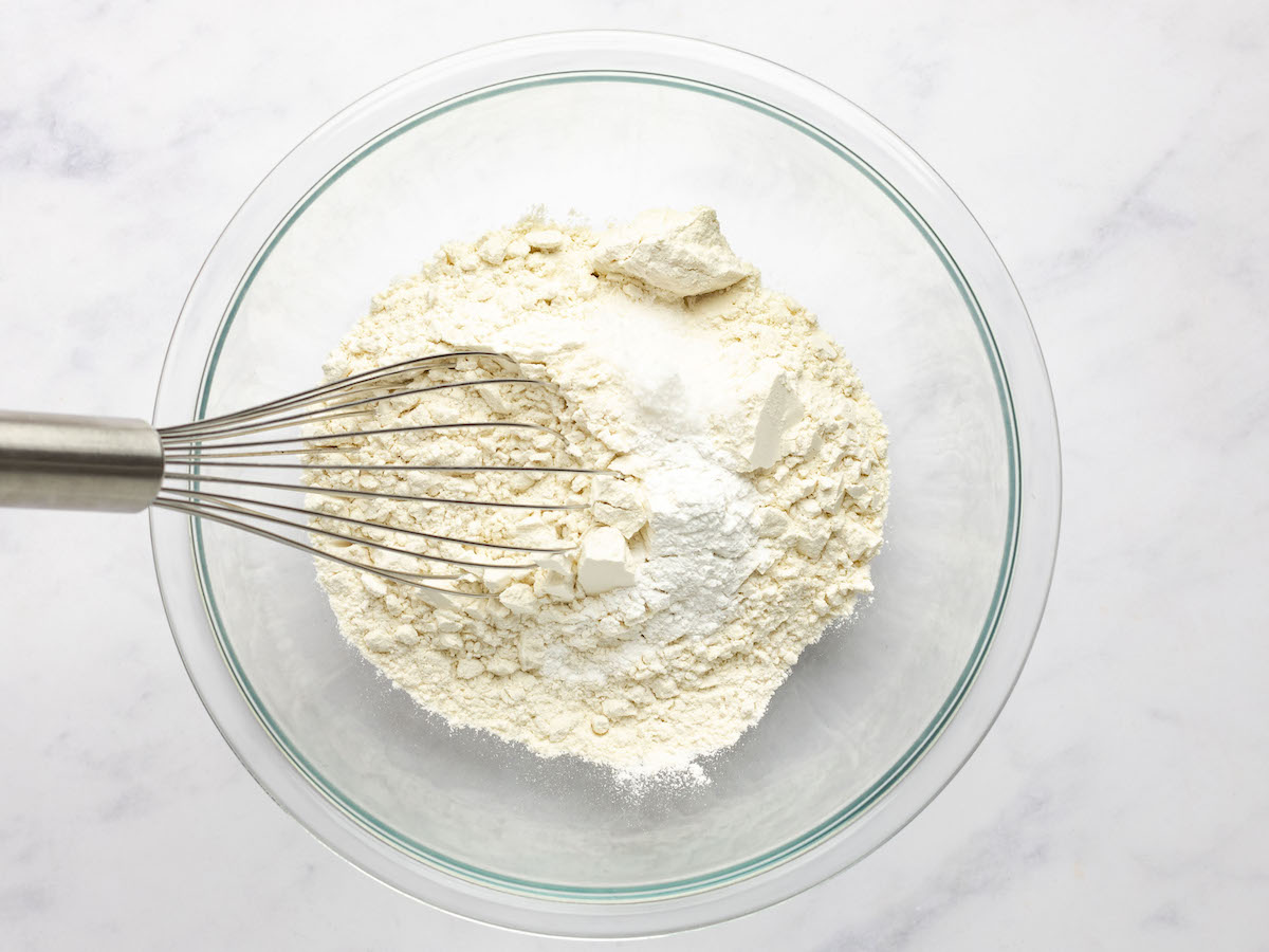 whisking flour, baking powder, and salt in a medium bowl