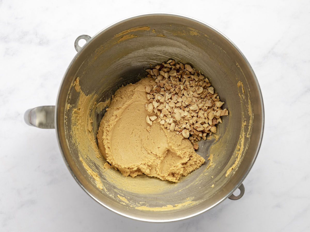 mixing bowl with chopped peanuts added to remaining dough