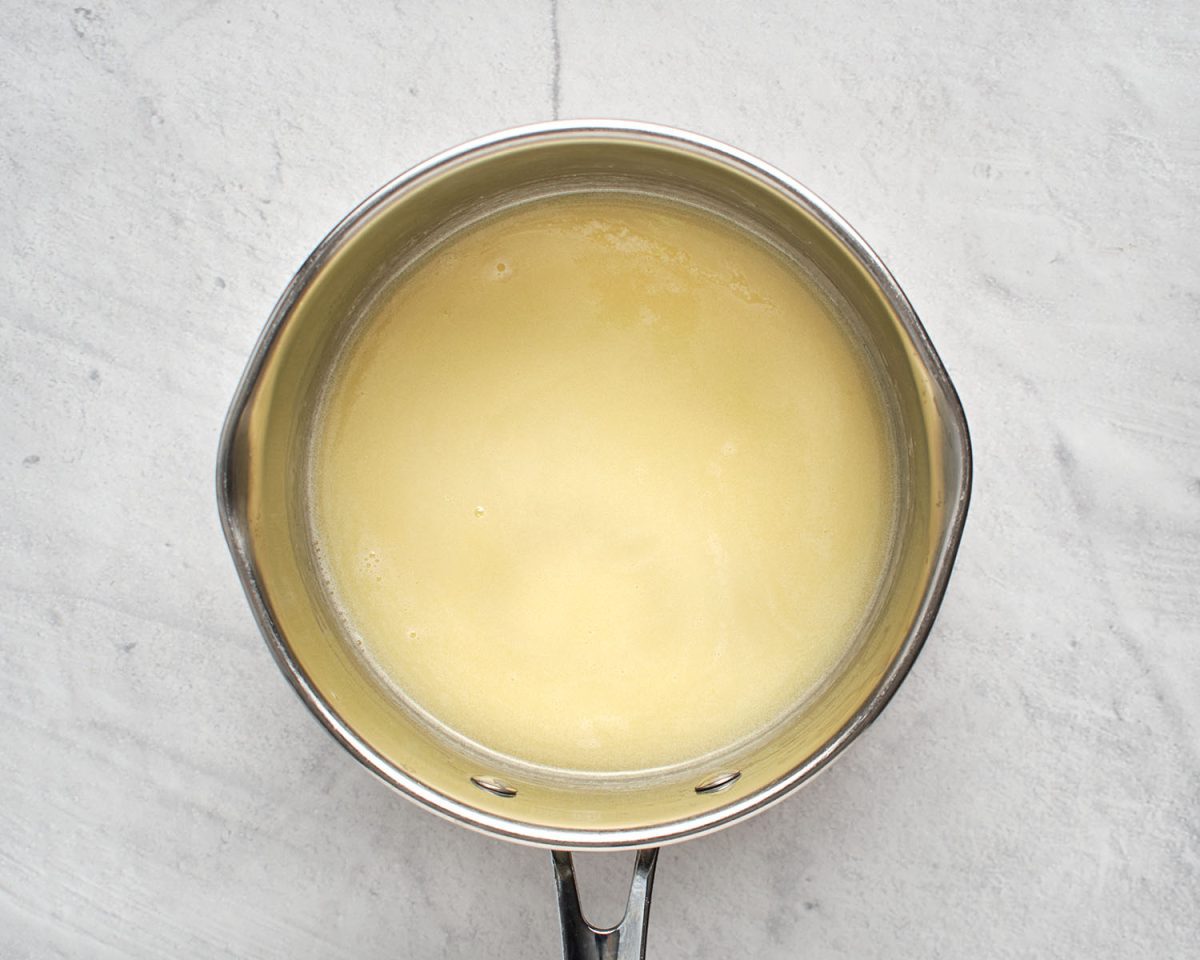 cream, butter, sugar, and salt simmering in medium saucepan