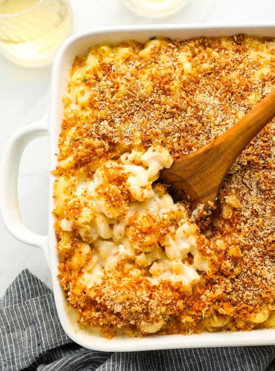 mac and cheese in baking dish with serving spoon