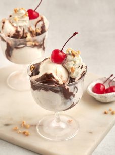 hot fudge sundaes with bowl of cherries