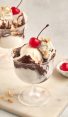 hot fudge sundaes with bowl of cherries