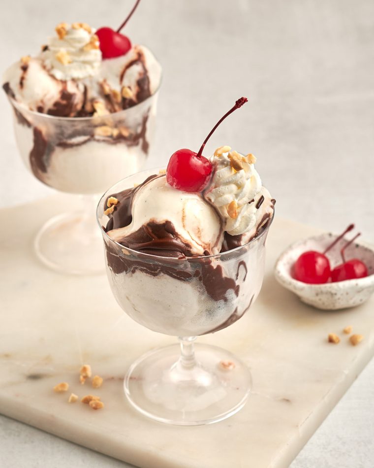 hot fudge sundaes with bowl of cherries