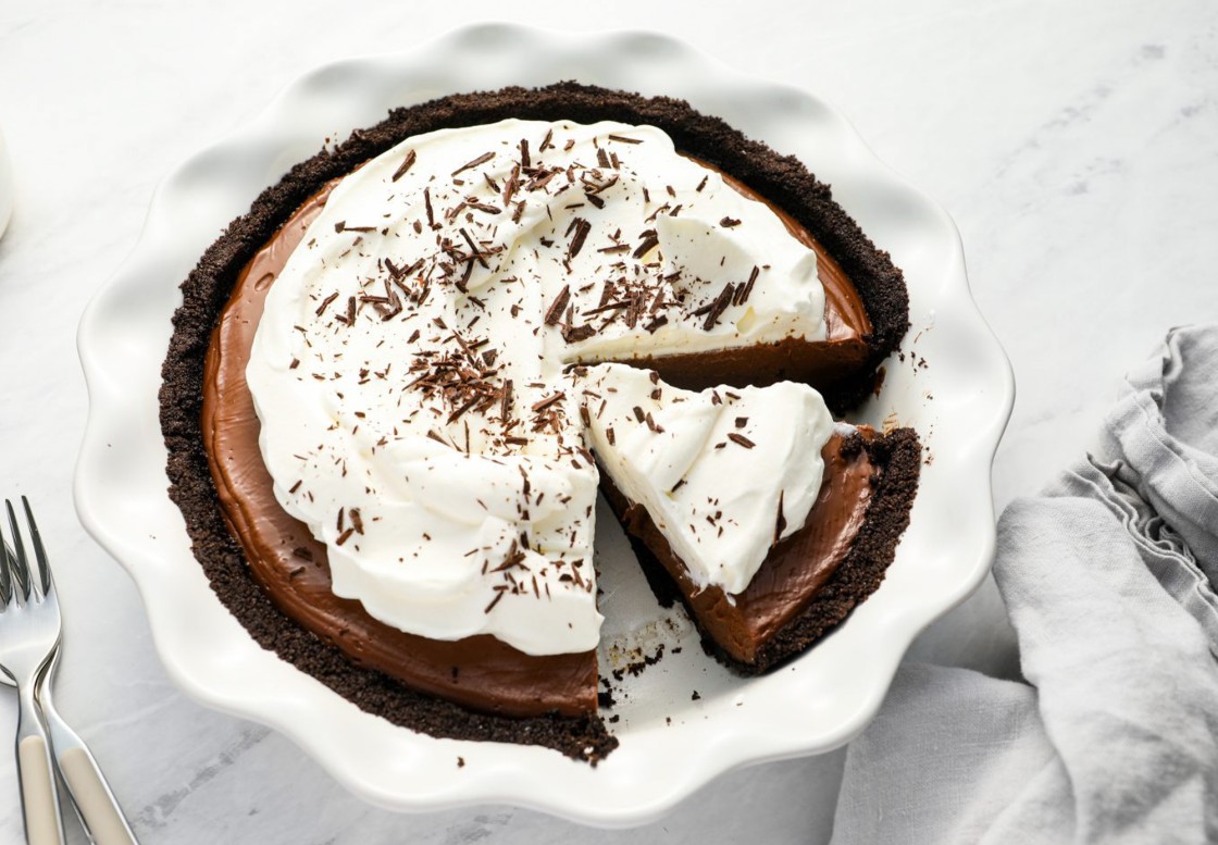 sliced chocolate cream pie with linen napkin