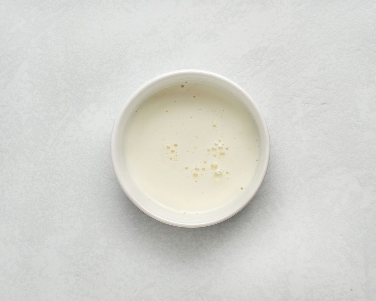 cornstarch mixed with 2 tablespoons of milk in white bowl