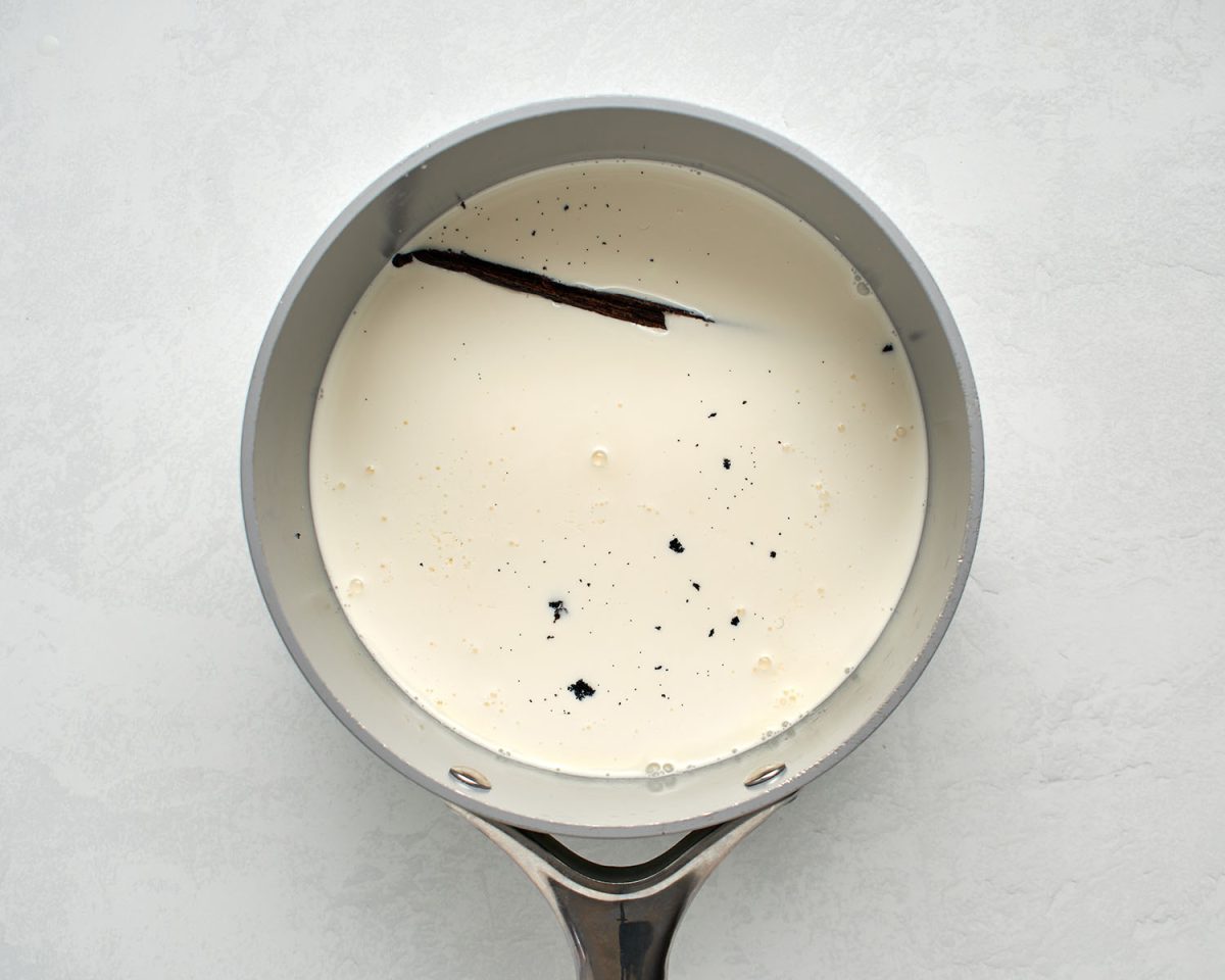 large saucepan with milk, the heavy cream, sugar, corn syrup, salt, and vanilla bean and seeds