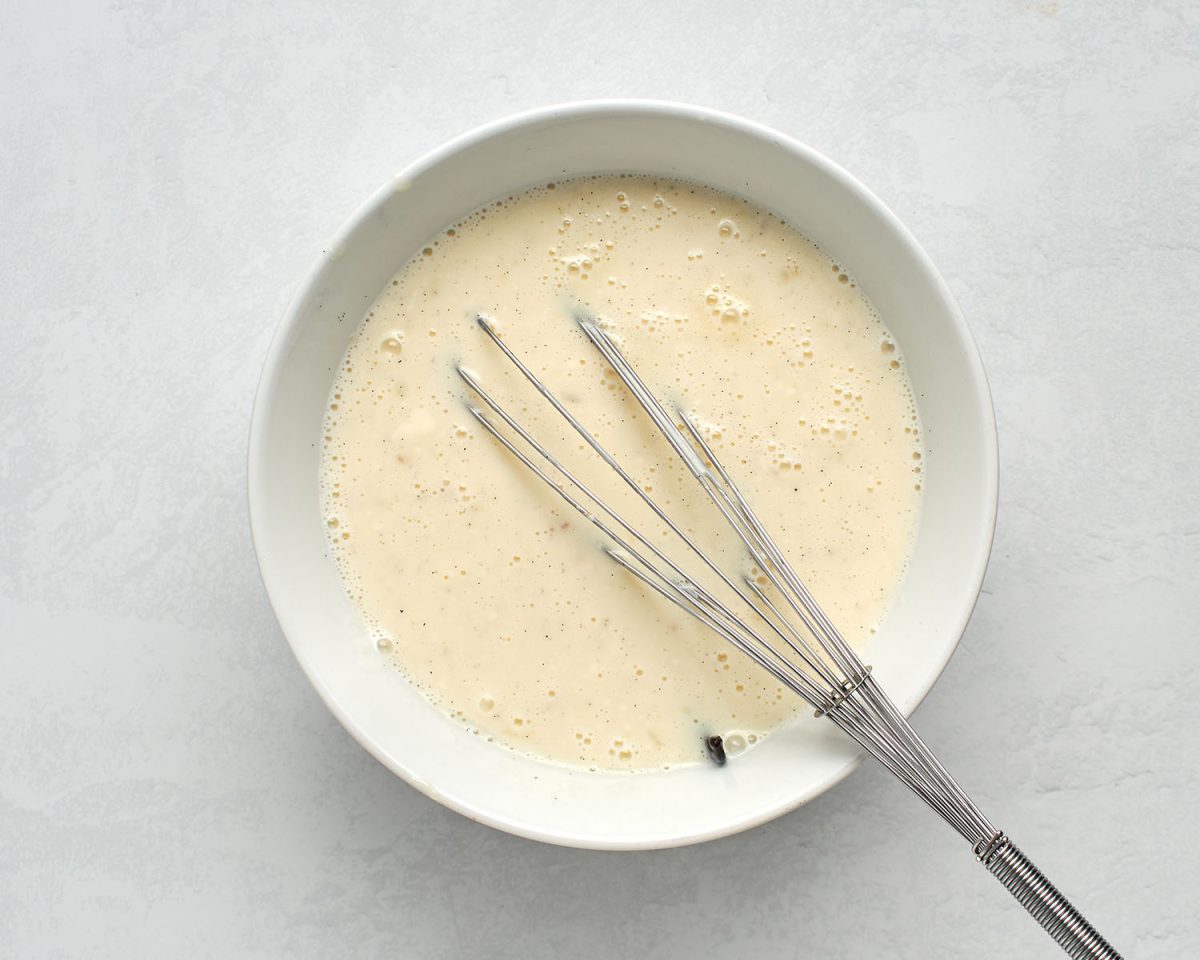 whisk and contents of saucepan in bowl containing whipped cream cheese