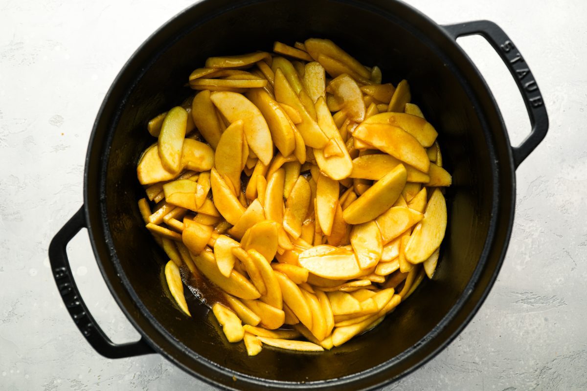 cooked sliced apples in Dutch oven