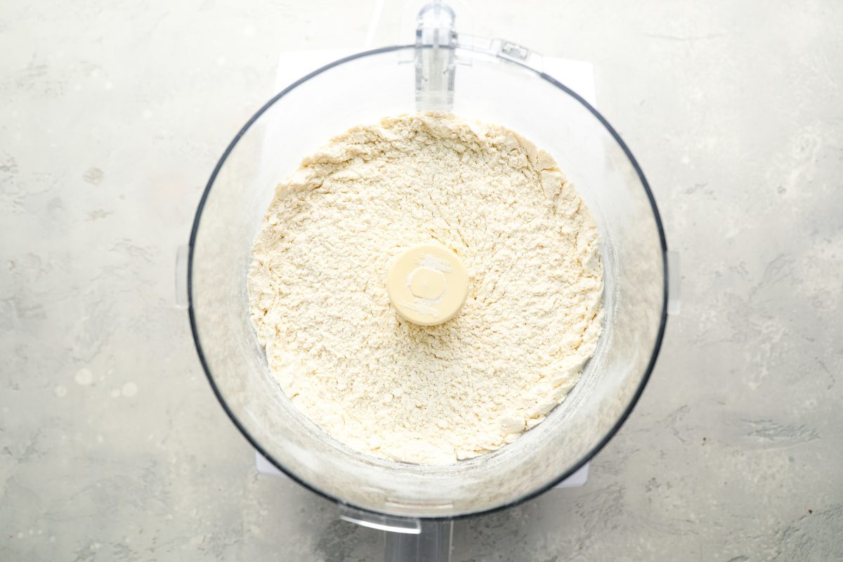 flour, sugar, salt, and baking powder in bowl of food processor 