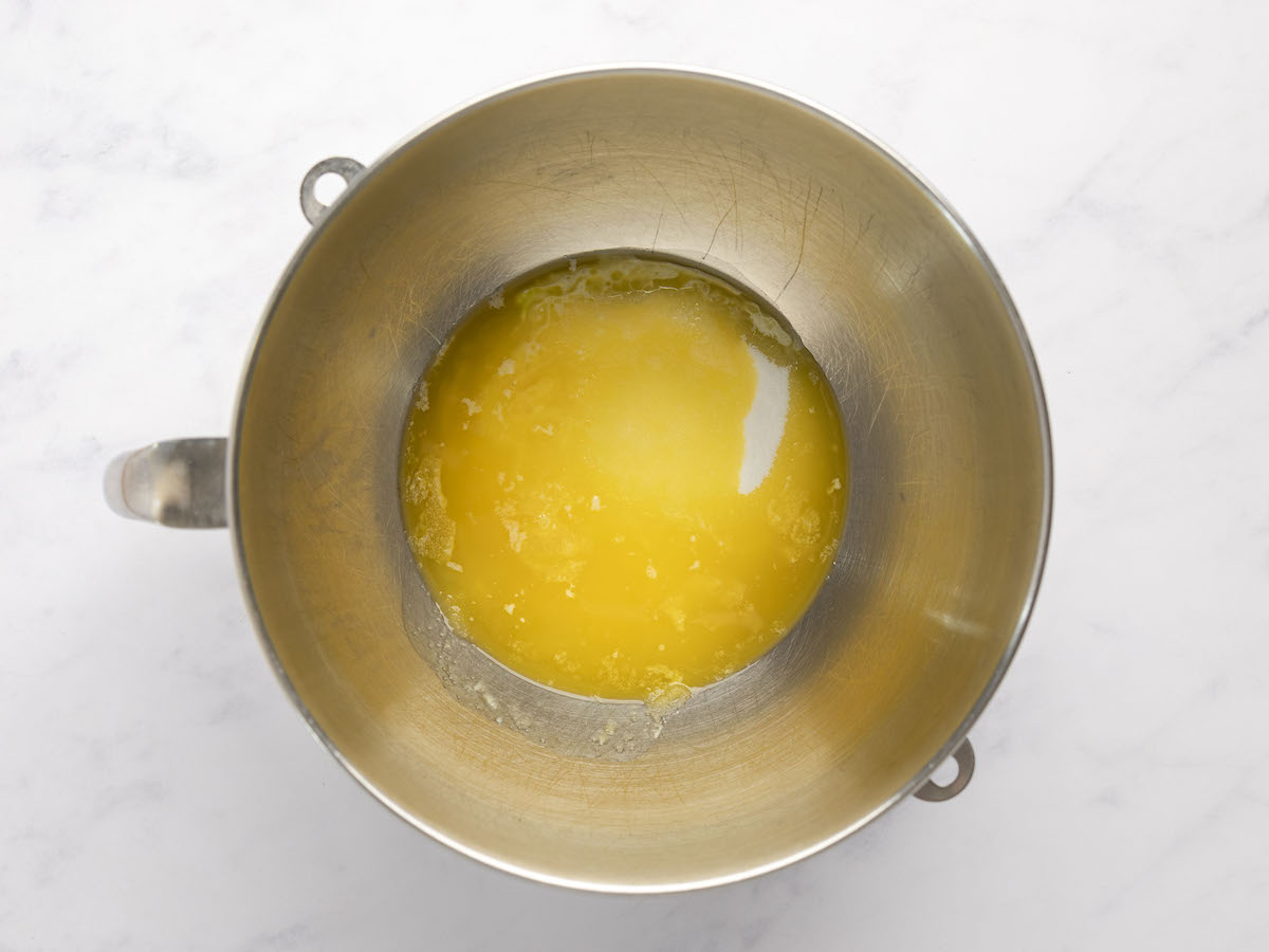 melted butter in bowl of electric mixer
