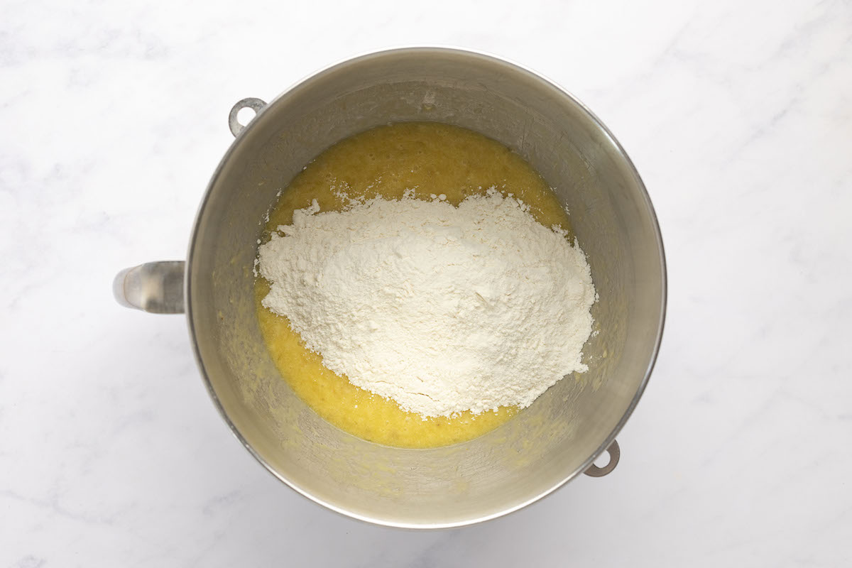 flour, salt and baking powder added to wet mixture in metal mixing bowl