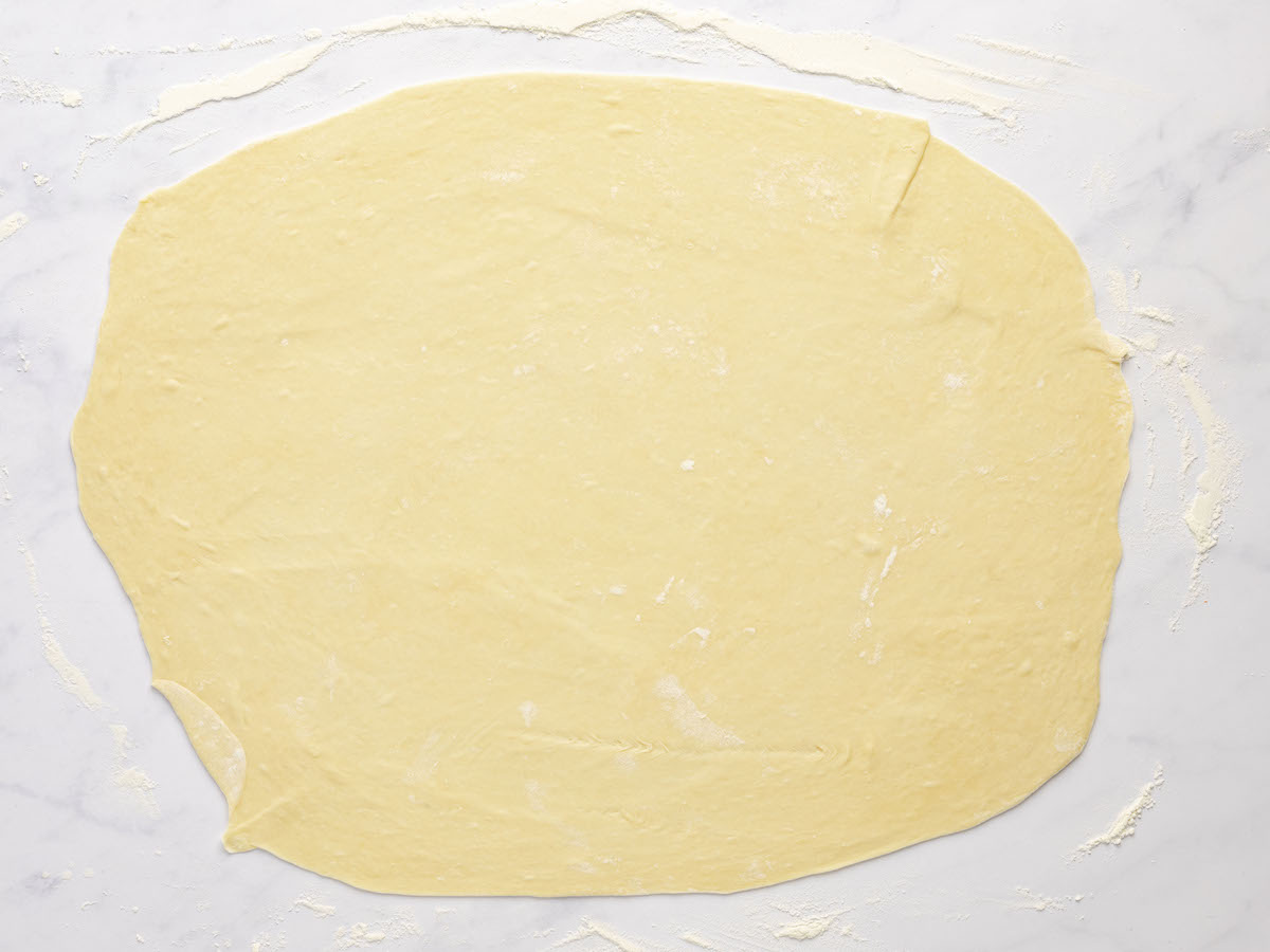 1/2 of the dough rolled out thinly on clean work surface